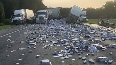 A truck collision turns a Florida highway into a silver sea of beer cans