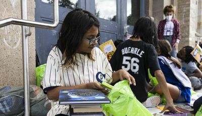 ‘I’m going to read them all.’ Grade schoolers get excited about book donation during Bernie’s Book Bank’s crosstown charity walk