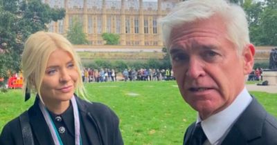 Phillip Schofield and Holly Willoughby were heckled as they walked past public Queen queue