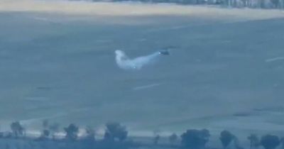 Moment Ukrainian soldier blasts Russian helicopter out of the sky with missile launcher
