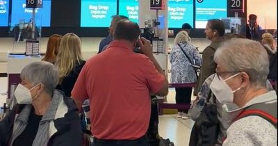 Edinburgh Airport passengers in long queue as 'no airline staff to check them in'