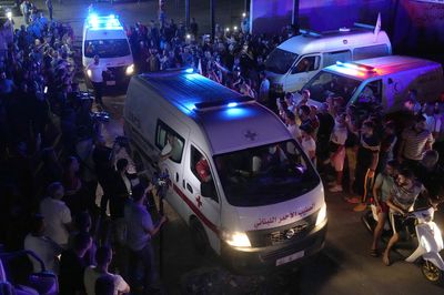 At least 77 people died when a boat carrying migrants sank off Syria, an official says