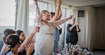 Bride poses for photos and carries on with wedding after groom stood her up on the day