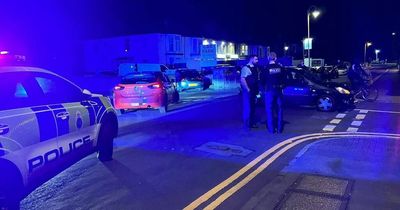 Road blocked by police as car and cyclist crash