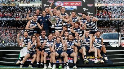 Geelong wins AFL premiership after thrashing Sydney Swans by 81 points in grand final at MCG