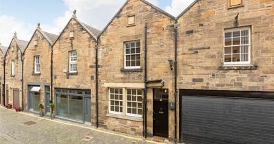 Edinburgh city centre property with exposed wooden beams hits market