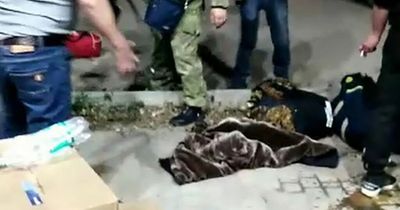 Bungling Russian officials try to recruit the dead as conscripts turn to booze