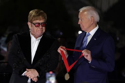 Joe Biden presents ‘flabbergasted’ Elton John with National Humanities Medal at White House