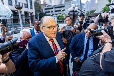 Man charged with assault for tapping Giuliani on the back signals potential $2m lawsuit for false arrest