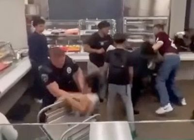 Investigation launched after video shows Texas officer slamming student into a lunch cart