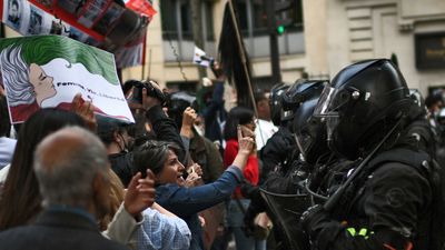 Police clash with protestors outside Iranian embassies in London and Paris