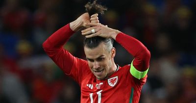 Wales fans left baffled as Gareth Bale spends an age fixing man bun while trying to tackle Polish player