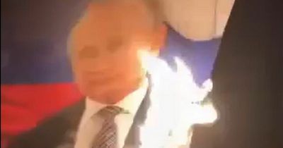 Anti-war protesters burn portraits of Vladimir Putin as anarchy spreads over Russia war