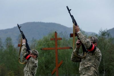 Ukraine probes suspected mass burial on Russia border