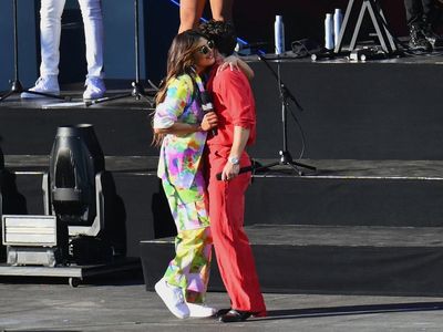 Fans cheer as Priyanka Chopra runs to kiss husband Nick Jonas on stage at Global Citizen Festival