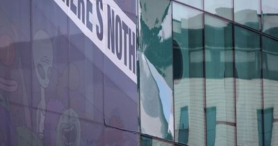 Investigation launched after crane cracks glass windows at Old Trafford football ground