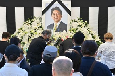 Mourners and protesters turn out for slain ex-PM Abe