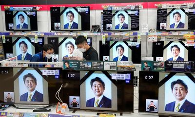 Abe's militaristic funeral captures Japan's tense mood