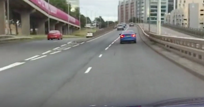 Footage shows two cars racing down Glasgow Clydeside Expressway