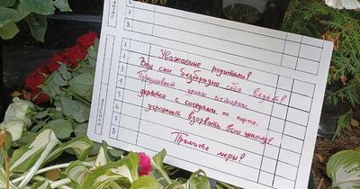 Protesters put notes on Vladimir Putin's parents' GRAVE saying 'your son is disgraceful'