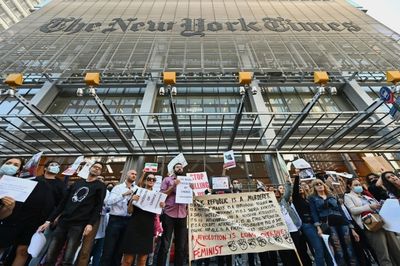 Activists protest in Manhattan for women in Iran, against the NYT