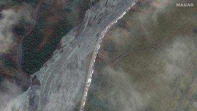 Satellite images show long queues out of Russia as enlistment centre reportedly established at Georgia border