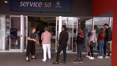 Optus data leak victims face long queues to change drivers licence numbers at Service SA locations