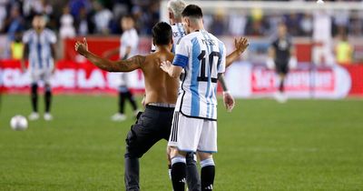 Lionel Messi tried to sign pitch invader's bare back after scoring 90th Argentina goal