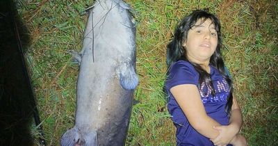 Girl, 10, catches record 8ft alligator fish just 10 minutes into fishing trip with dad