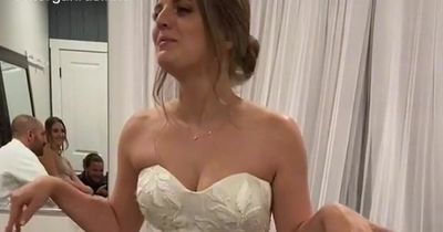 Bride impulsively cuts her wedding dress for reception after getting 'too hot'