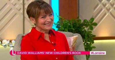 Lorraine Kelly tells David Walliams to 'watch the cameras' as he crawls off show