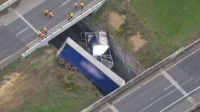 Driver killed as truck plunges off Western Highway onto train tracks near Ballarat