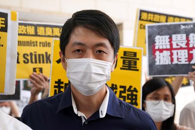 Self-exiled Hong Kong democrat sentenced to 3 1/2 years in jail in absentia