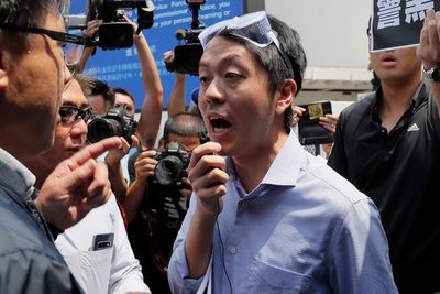 Former Hong Kong lawmaker sentenced to 3 1/2 years in jail