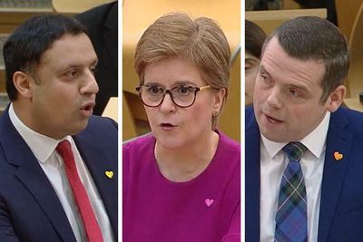 Why were Holyrood's party leaders wearing heart-shaped badges at FMQs?