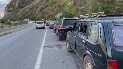 Traffic at a standstill at Russia-Georgia border as it's thought at least 170,000 have 'fled' the country