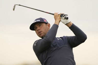 Gary Woodland’s wayward tee shot bounced into a spectator’s cup holder for a different kind of hole-in-one