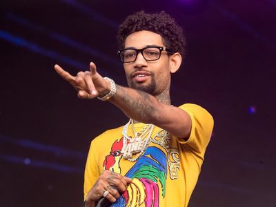 Father, teenage son charged in killing of rapper PnB Rock