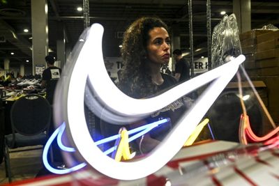 Nike shares tumble as it reports lower profits