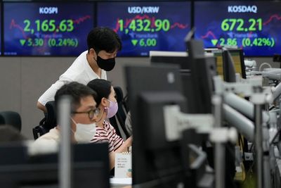 Asian stocks sink on German inflation, British tax cuts
