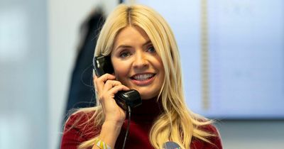 Holly Willoughby all smiles as she's given round of applause during charity appearance