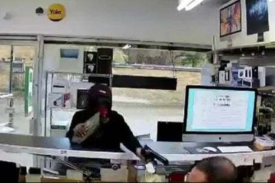 Isle of Dogs: Video shows terrifying moment pistol is aimed at shopkeeper’s head in east London robbery
