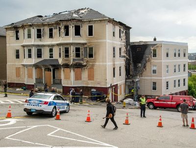 Woman charged with setting fire at apartment that killed 4