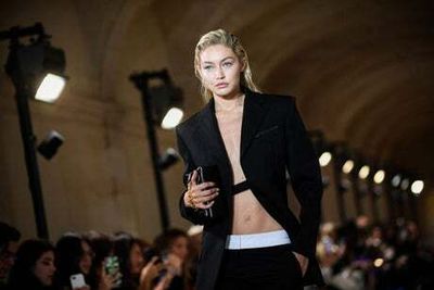 ‘Thank you Paris, I love you’: Victoria Beckham makes Paris Fashion Week debut with Gigi and Bella Hadid on catwalk