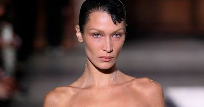 Bella Hadid emerges naked before dress is sprayed onto her body at Paris Fashion Week