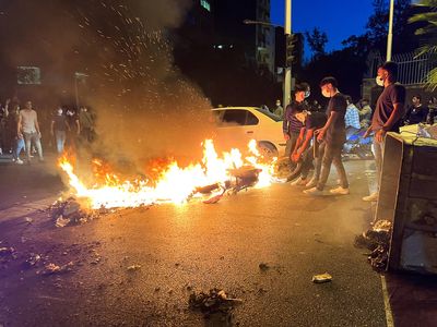 Protesters rally across Iran in third week of unrest over Amini's death