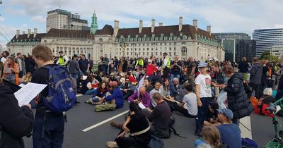 Extinction Rebellion protesters bring central London to a halt as activists block Westminster Bridge