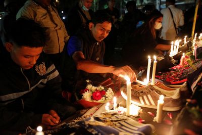Indonesia soccer stampede kills 125 after police use tear gas in stadium
