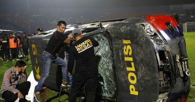 More than 100 fans trampled to death at football match in Indonesia