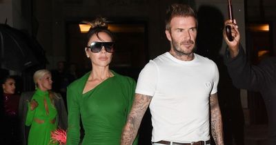 Victoria Beckham holds hands with David as family celebrate her Paris Fashion Week debut